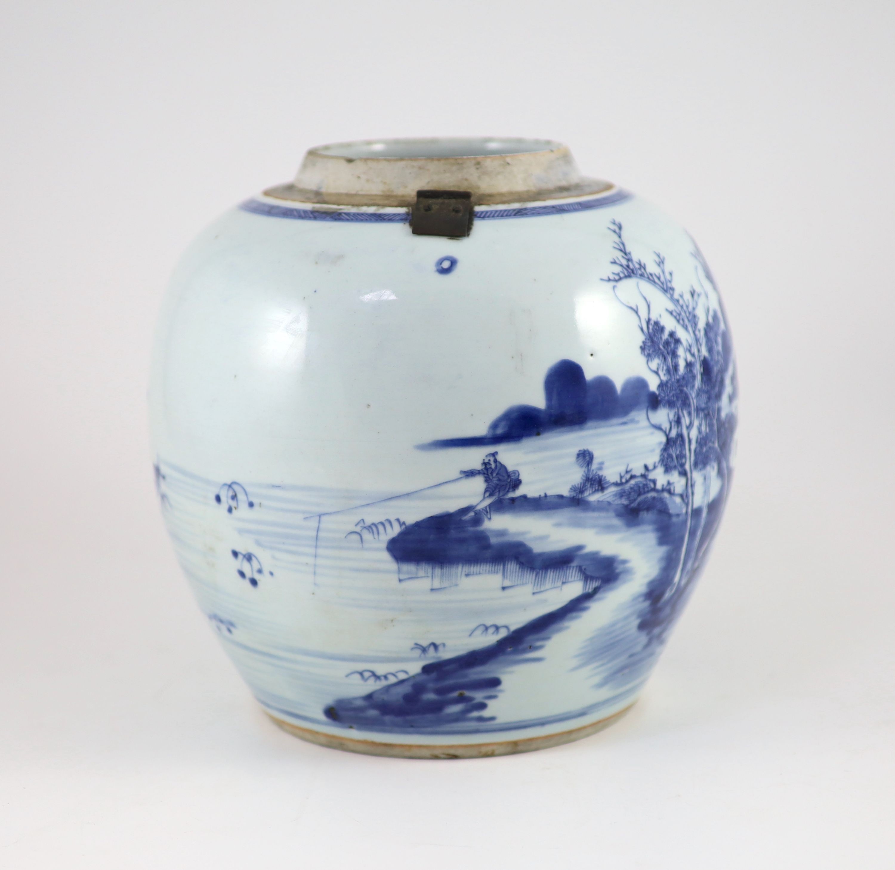 A Chinese blue and white jar and cover, Kangxi period (1662-1722), 23cm high, metal fittings attached to shoulder, Cover repaired and not the best fit